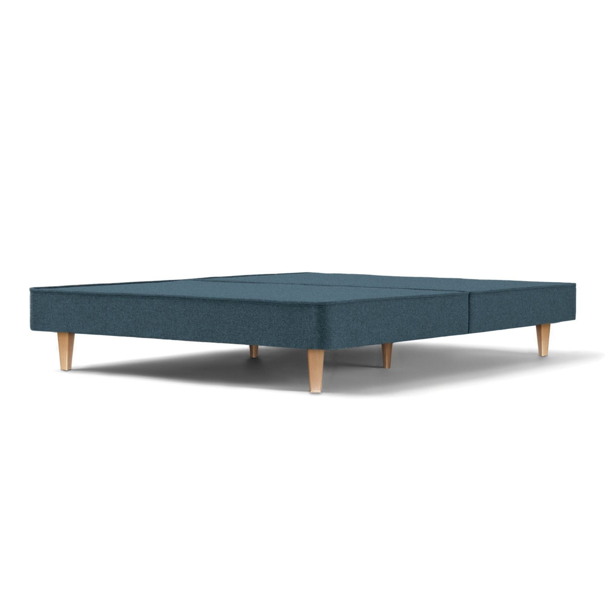 The Woolroom Audley Upholstered Divan with wooden legs in the colour Hemlock, which is a blue upholstery.