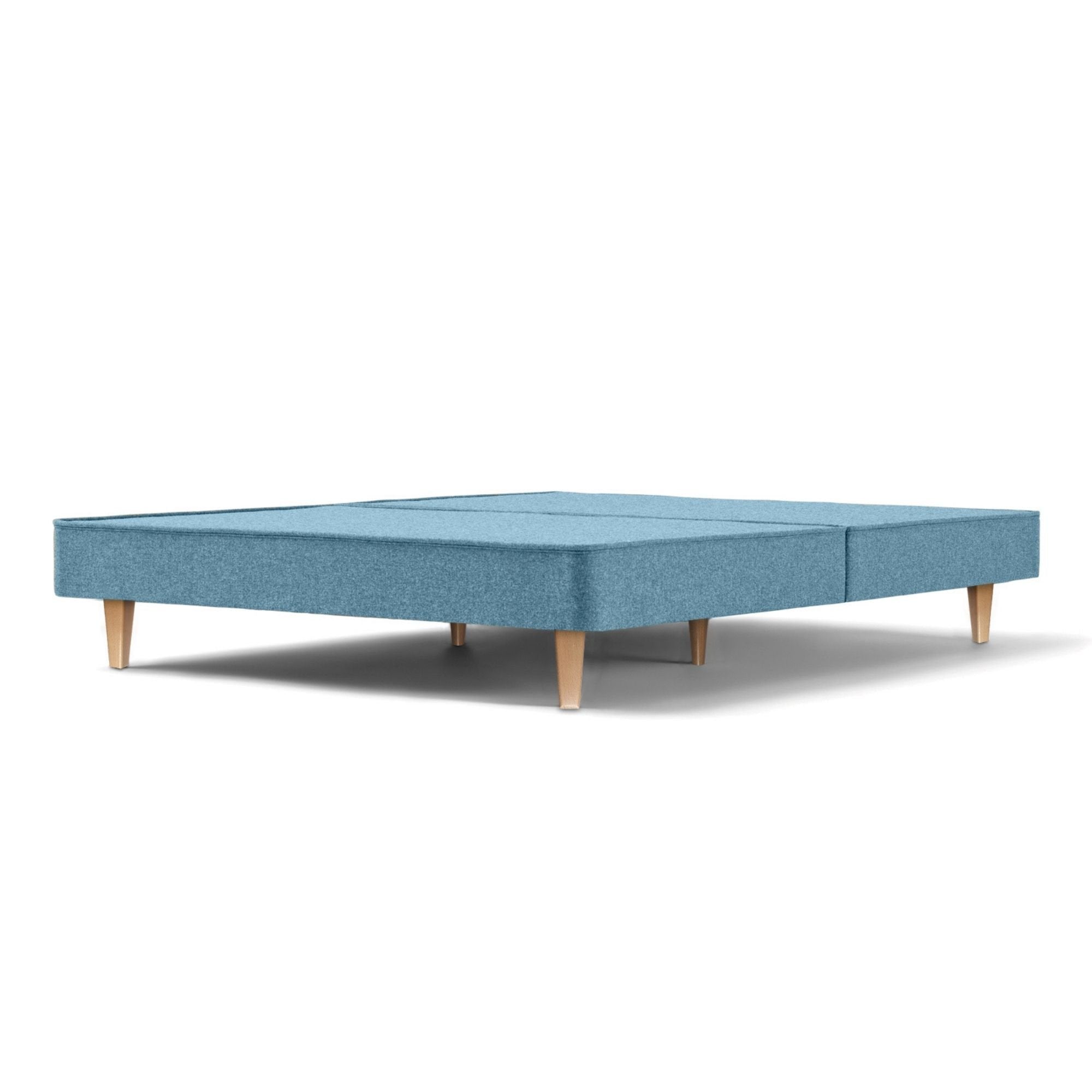 The Woolroom Audley Upholstered Divan with wooden legs in the colour Juniper, which is a light blue upholstery.